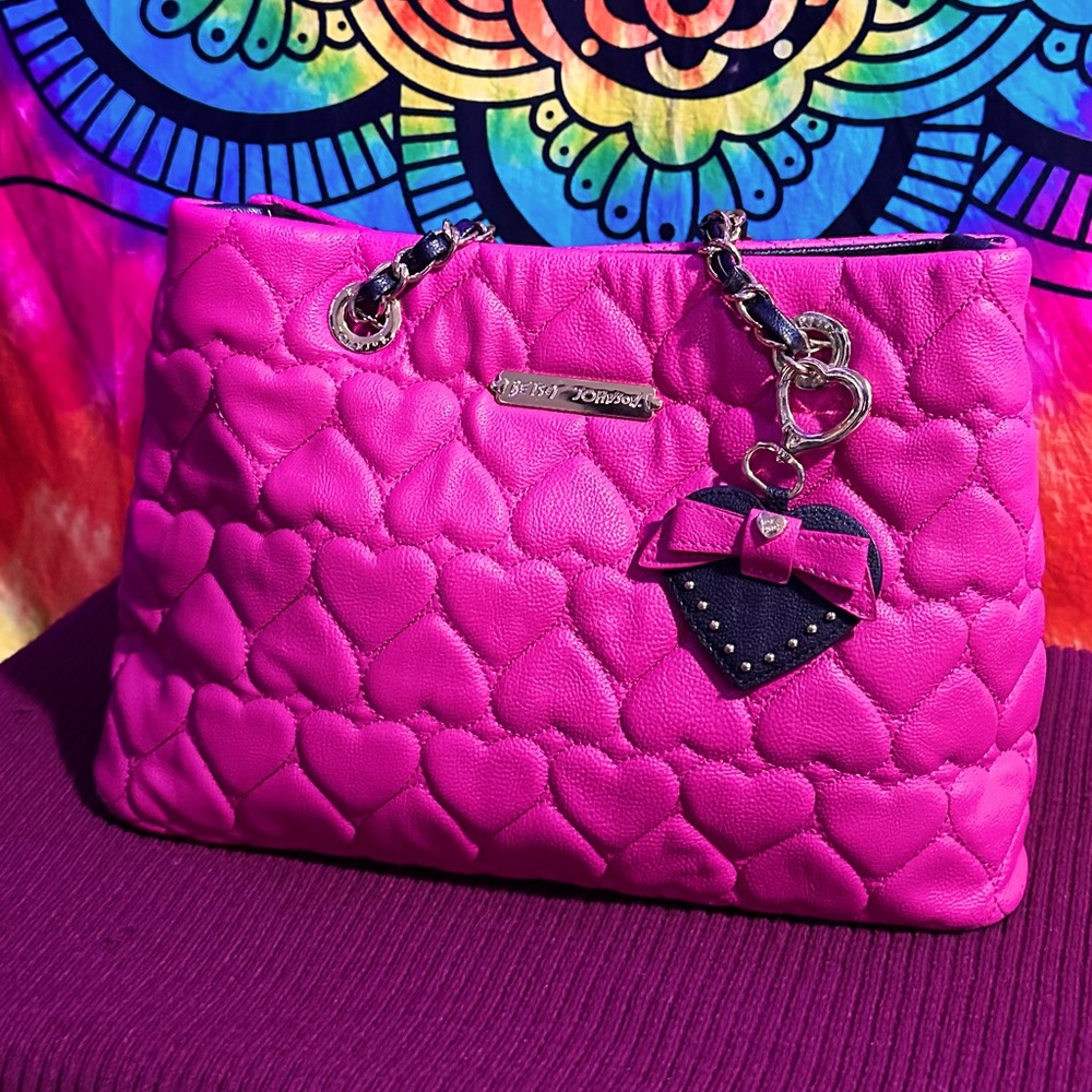 I am selling a Betsey Johnson purse. Fun pink
